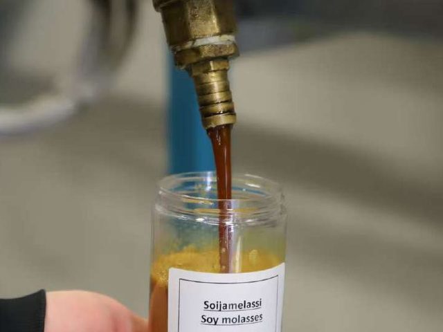 Soy molasses side stream poured into a sample jar