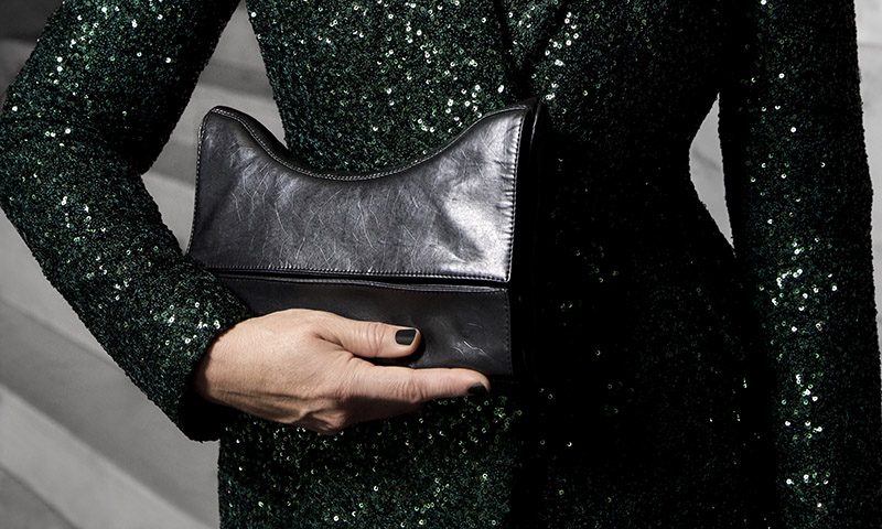 The Versa clutch bag held at the waist