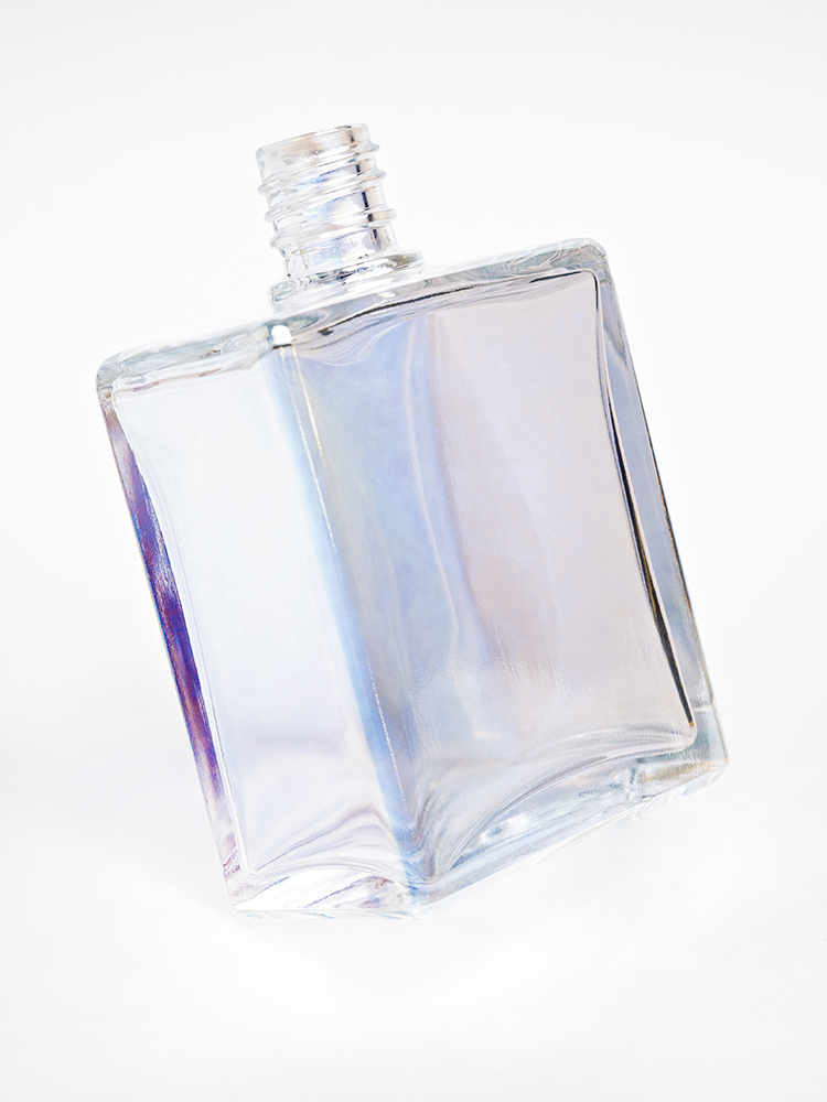 A glowing perfume flacon on a hot-end forming line